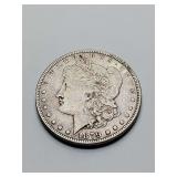 United States Morgan Silver Dollar, minted in 1879. Weighs 26 grams.