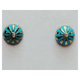 Sunburst design stud earrings with alternating rays of turquoise enamel and gold-toned metal, centered by a single small clear gemstone.