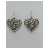 Vintage-inspired filigree heart dangle earrings, faceted rhinestones or faux diamonds, openwork "filigree" metal pattern with a central cluster of sparkling stones.