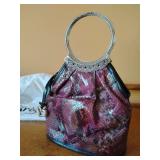 Brighton Faux Snake Skin Red Handbag featuring a distinct etched silver hoop handle and a branded heart charm, 10 1/2" x 8".