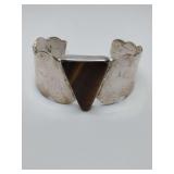 Vintage Mexico 925 sterling bold mcm silver cuff bracelet with a central, triangular-cut tiger