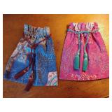 2 New fabric drawstring bags with patterned designs and decorative tassel closures. 9" x 10".