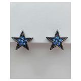Star-shaped stud  earrings are Amrita Singh blue crystal stud earrings in a gunmetal setting. Need backs.