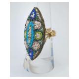 Vintage micro-mosaic ring, handcrafted in Italy 
This style of jewelry, known for its intricate detail, uses tiny glass pieces called tesserae to create delicate floral and geometric patterns. Has siz
