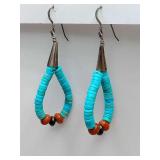 Native American Jacla-style dangle earrings,loop of stacked turquoise heishi beads accented at the bottom with vibrant pops of color from materials like coral or spiny oyster. Sterling conical top.