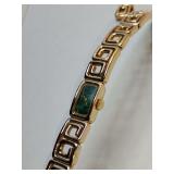Cresaux 14K vintage wristwatch distinctive gold rectangular case dark green face and a bangle bracelet with a Greek key pattern. Weighs 49 grams with one extra link