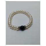 Freshwater cultured pearl and black onyx bead stretch bracelet, decorative crystal spacers.
