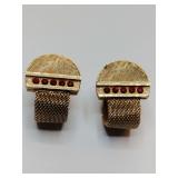 Vintage Cufflinks mesh wrap around with red stones. One has a chip.