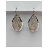 Silver teardrop dangle earrings with a glitter or Druzy finish.