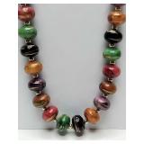 Vintage 1980s multicolored beaded statement necklace featuring swirled acrylic beads and gold-tone spacers.