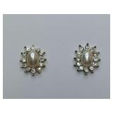 Vintage-style earrings feature a central faux pearl surrounded by small rhinestones in a halo or floral design. Need backs