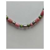 Native American-style necklace featuring pink rhodonite beads, turquoise beads, and sterling silver accents.