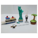 Porcelain hinged trinket boxes, st. thomas cruise ship, statue of liberty, her arm is broken, milkshake, coconut tree, fishing pole w/basket. Cruise ship is empty.