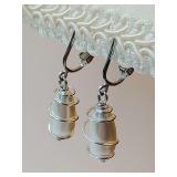 Vintage Sarah Coventry "Caged Pearl" dangle clip-on earrings featuring silver-tone wire-wrapped faux pearls.