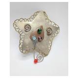 Handcrafted mixed-metal star piece, designed as a decorative whimsical brooch pin.