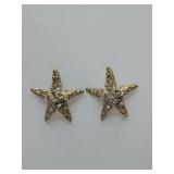 Gold-plated (white gold) starfish earrings feature a sparkling rhinestone-encrusted design and a textured finish. Mixed backs