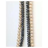 Double strand necklacewith faceted black crystal beads and beige faux pearls, they could be real seem to have an irregularity about them. The clasp has 925 stamped on it. 7" long.