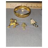 Ladies bangle bracelet and 3 brooches.