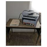 Printer, table, and file cabinet.