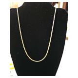 Gold chain. Clasp indicating karat marking is broken off. 20 in long. Weight 4.05 grams.