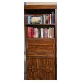 Vintage two-door, two shelf bookcase with drop down desk area. 28x15x72 in tall. Contents are NOT included.
