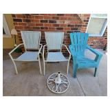 Two patio chairs, one Adirondack chair, and an umbrella stand.