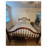 Queen bed and bedding.