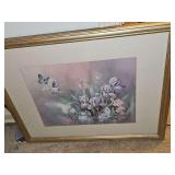 Framed print of irises and a butterfly. 21.75 x 17.5 in tall.