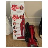 Two dirt devil vacuum cleaners.