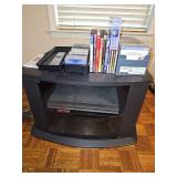 Sony video cassette recorder/dvd recorder with remote. Untested. Includes cassettes as shown, DVDs as shown, CDs as shown, and black entertainment cabinet. Front dimensions are 27.5 x 22 x 19 in tall.