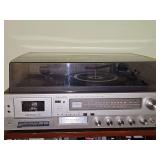 Realistic stereo player. Includes cassette player, 8-track player, AM FM, and turntable. Owner states turntable needs a belt and is easily replaced.