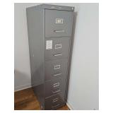Five drawer all steel file cabinet. Have not located the key. 14.5 x 28x60 in tall.