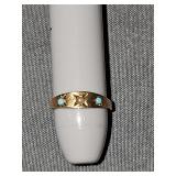 10K baby ring. Weighs .39 grams.