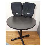 36-in diameter x 30 in tall table and two lined and padded computer bags.