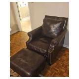 Jekalyn Smith leather chair with nailhead trim and ottoman. Chair is 35x36x38 in tall. Seat height 19 in. Ottoman is 27x 21x 16 in tall.