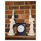 Two 11.75 in cherub candle holders and a clock with Roman numerals. Clock needs battery.