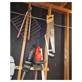 Two electric hedge trimmers - untested, hand saw, two hacksaws, and loppers.