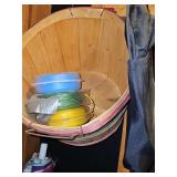 Miscellaneous grouping. Half bushel basket with weed eater line, quikrete bags, smoker chips, tie-down strap, two hammers. See all photos.