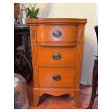 Vintage Federal style 3-drawer nightstand with a light brown mahogany finish and antique-style brass hardware