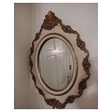 Vintage oval gilted and ivory colored framed mirror