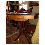 Antique mahogany side table with original casters
