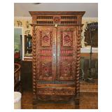 French antique Breton cabinet from the 19th century, featuring carved oak wood and a barley twist design.  76" Height 42" Width 18" Depth