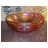 Vintage iridescent marigold/orange carnival glass bowl with a checkerboard or diamond pattern.