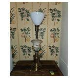 Vintage lamp featuring a hand-painted porcelain urn body, a brass base, and a white glass torchiere shade. Working condition