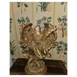 Gold-colored resin angel figurine, resembling designs from the "Glitter and Gold" collection by Seymore Mann.