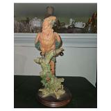 Scarlet Macaw parrot resin sculpture perched on a branch atop a fine wood base.