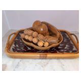 Grouping of wooden fruit bowl with water oden fruit sitting of a Magnolia Lane glass tray with peppers encased in the glass