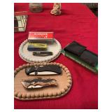 Vintage Fairmont Cultery 2 blade knife, Delta Ranger II new in box, Schrade Lockback in unopened box, stainless steel pocket knife with Kay’s new inbox, and a camouflaged hunting knife with eagle