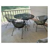 Black 41 1/2 inch round table with four chairs measuring 24” x 24” x 29”