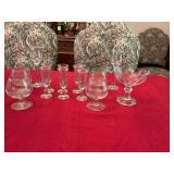 Mixed grouping of cordial’s, whiskey and candles with one pedestal bowl